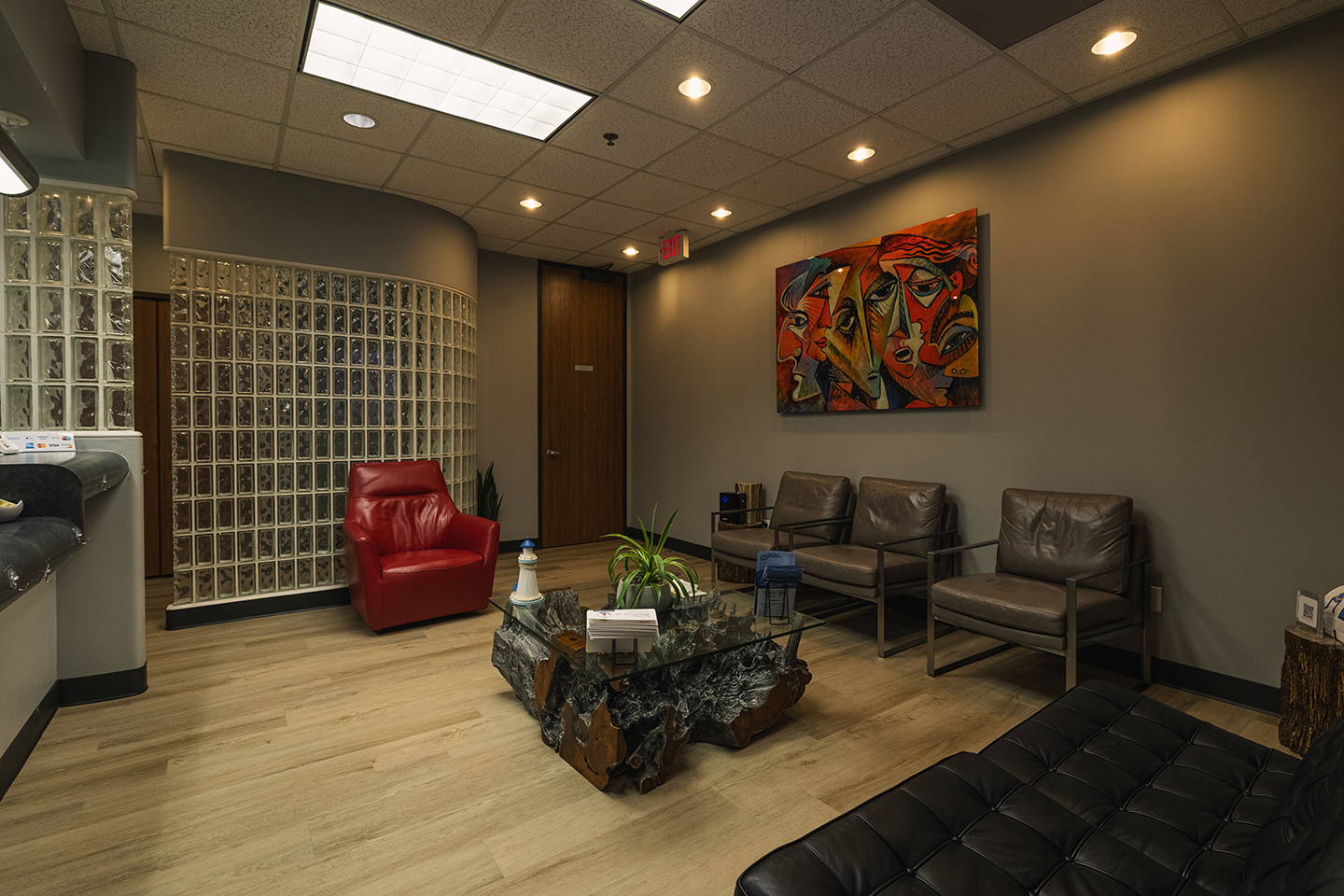 A calm, modern surgical suite with natural light and warm wood tones